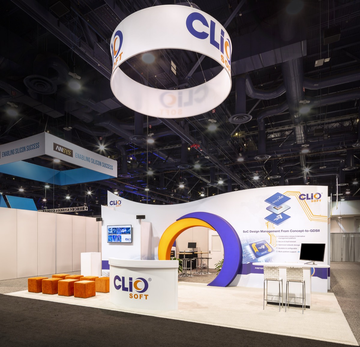 ClioSoft booth at DAC with circular hanging sign, built by Art & Display