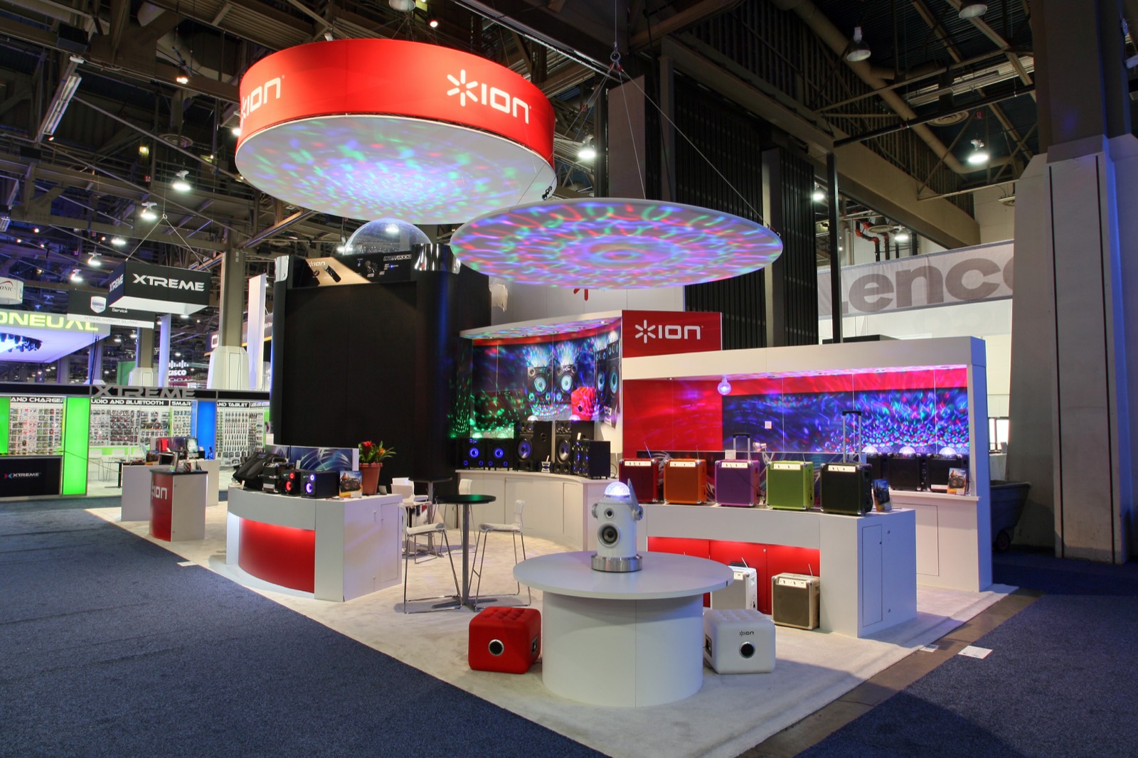 Ion Audio trade show booth with illuminated hanging rings, built by Art & Display